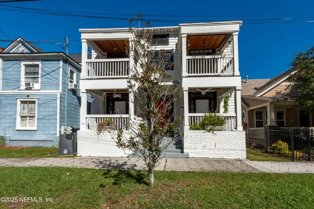 a view of front of house with a yard