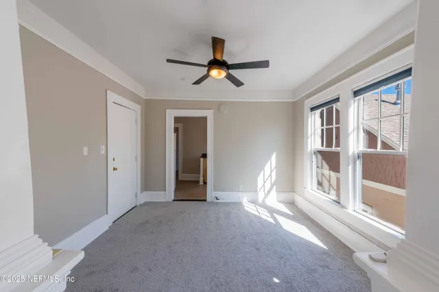 a view of empty room with windows