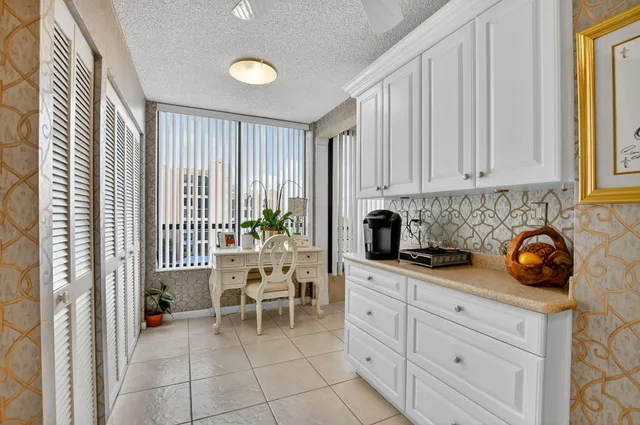 a view of a kitchen with furniture and staircase