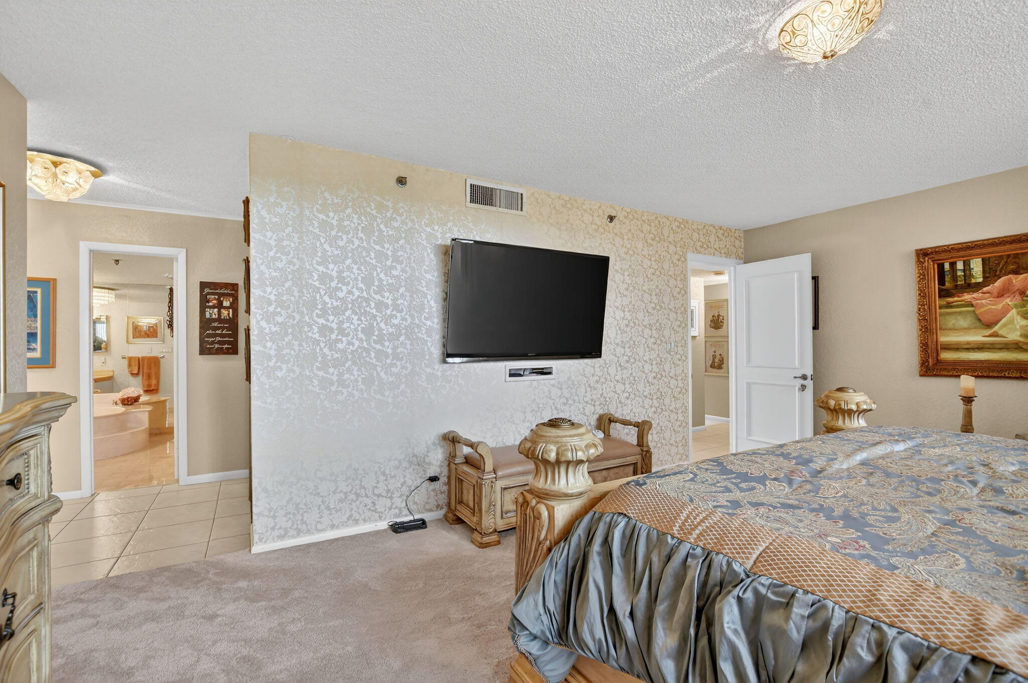 7178 Promenade Drive, Unit 502 Boca Raton, FL 33433 - Photo 19 of 33 a bedroom with a bed and a flat screen tv