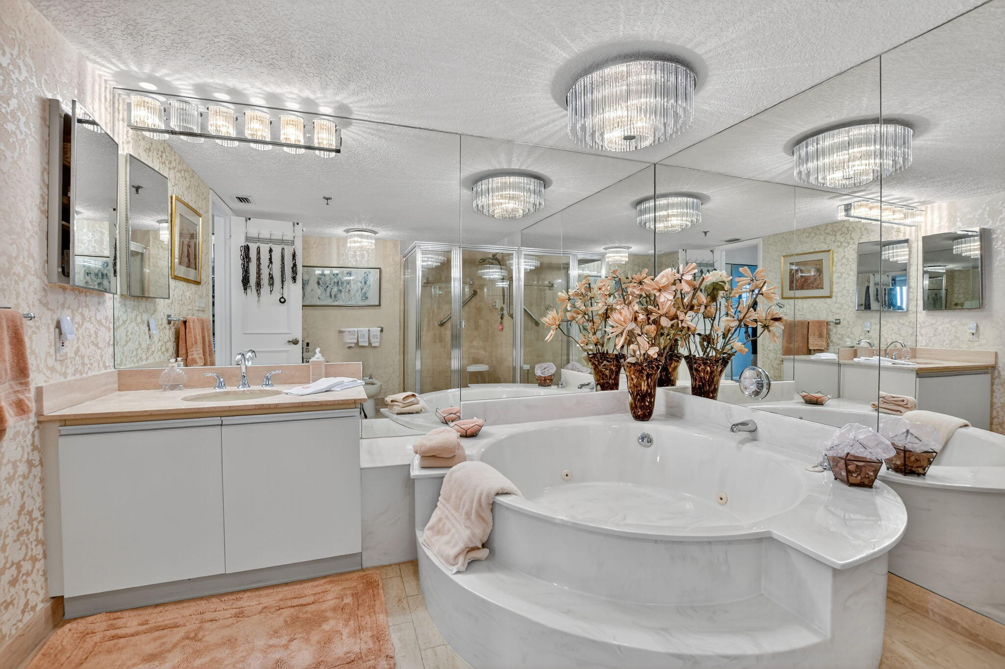 7178 Promenade Drive, Unit 502 Boca Raton, FL 33433 - Photo 21 of 33 a bathroom with a sink a large mirror and a bathtub