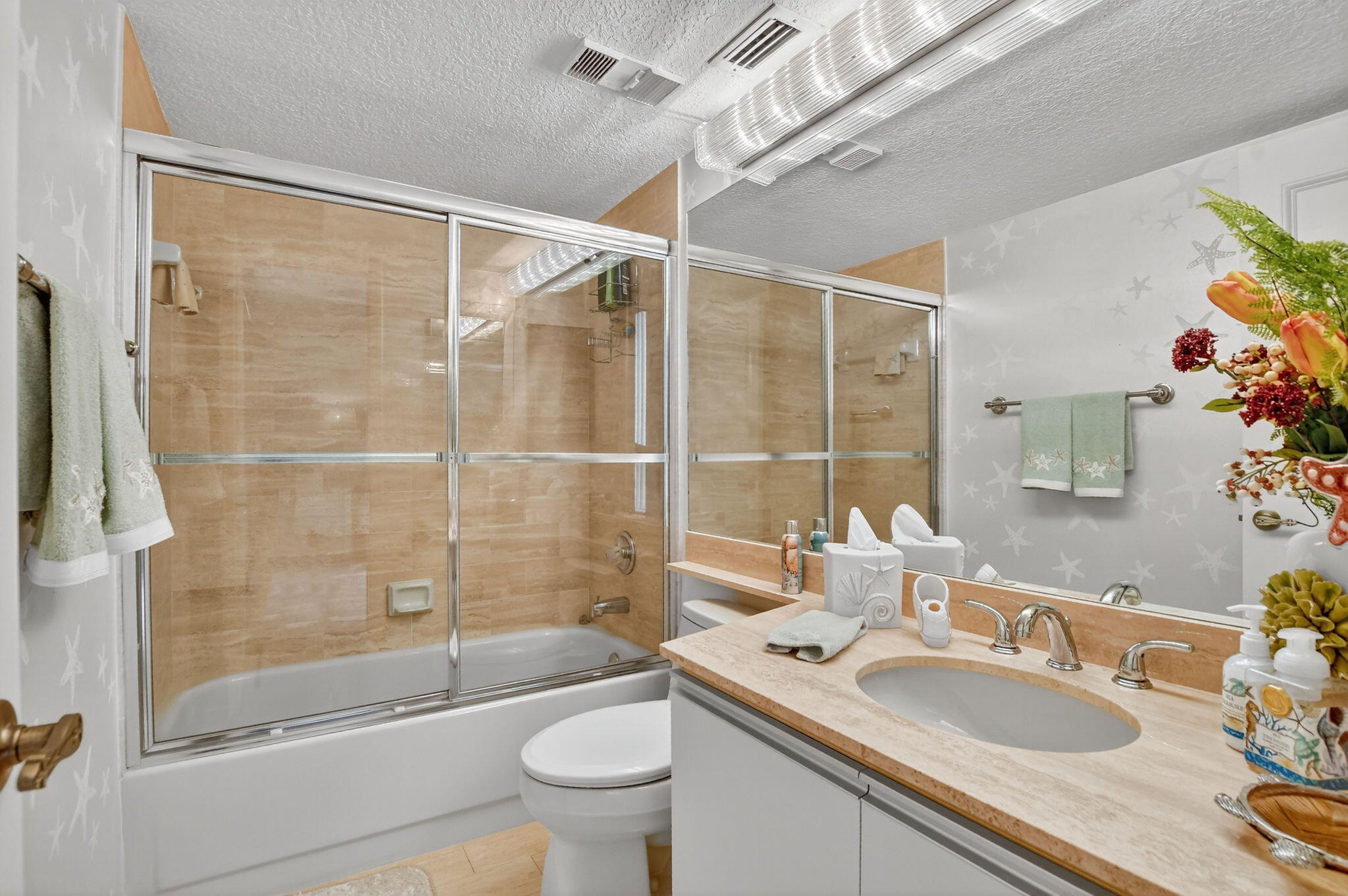 7178 Promenade Drive, Unit 502 Boca Raton, FL 33433 - Photo 27 of 33 a bathroom with a sink toilet tub and shower