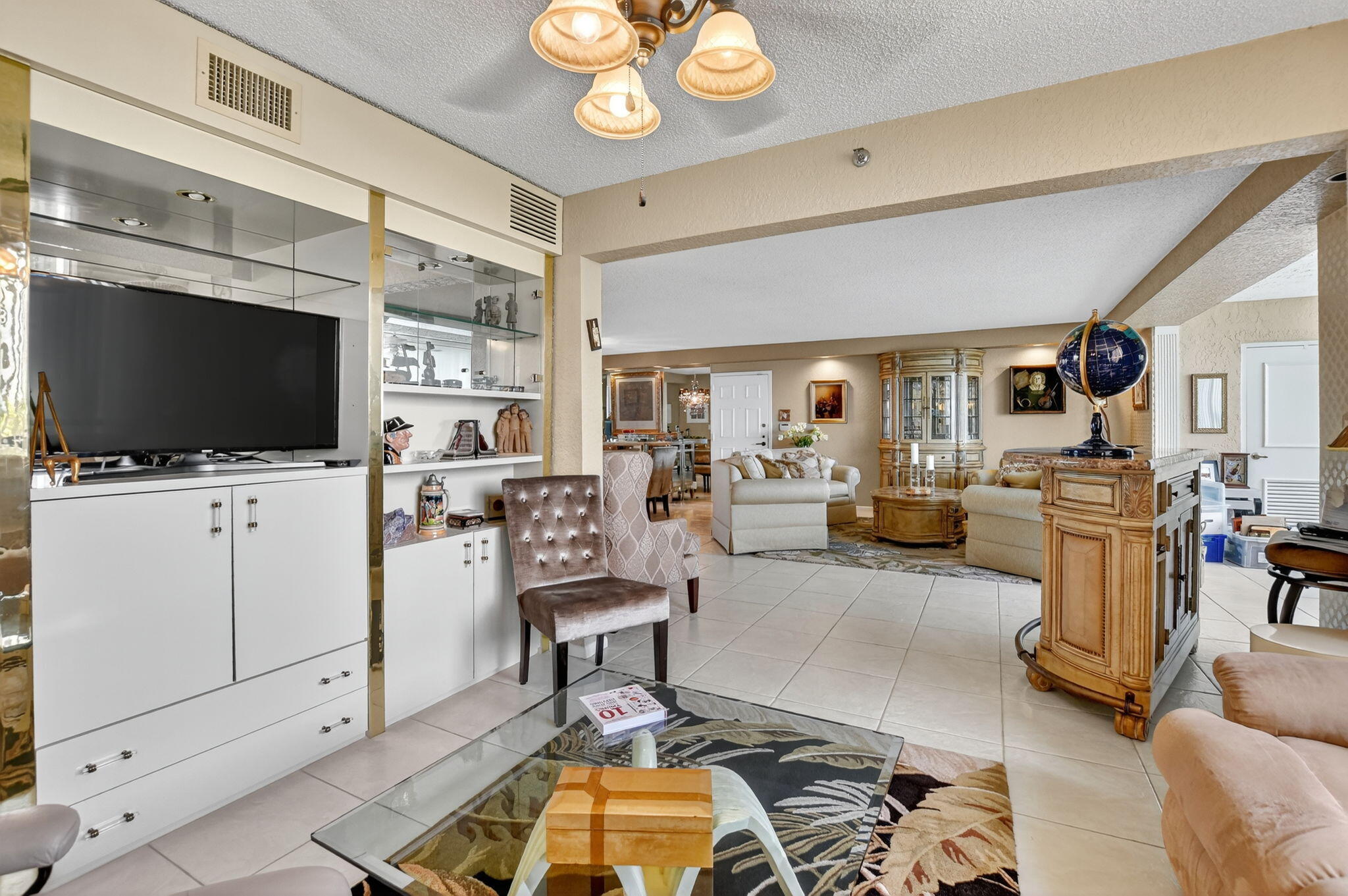 7178 Promenade Drive, Unit 502 Boca Raton, FL 33433 - Photo 10 of 33 a living room with furniture and a flat screen tv