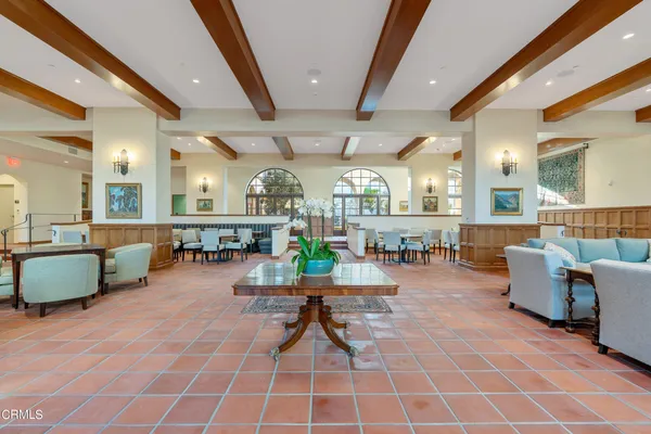 a view of a hallway with windows and closet