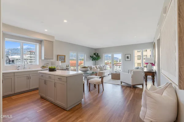 a kitchen with a sink a stove and cabinets