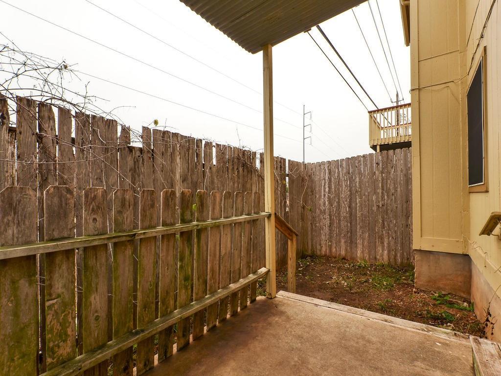 4300 Acropolis Court, Unit A Austin, TX 78759 - Photo 13 of 14 Fenced backyard featuring a patio area