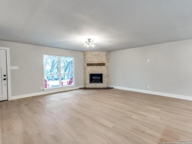 a large kitchen with stainless steel appliances kitchen island a large counter top and a sink