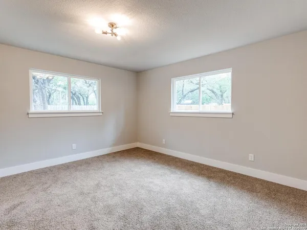 a bathroom with a sink a mirror and a toilet