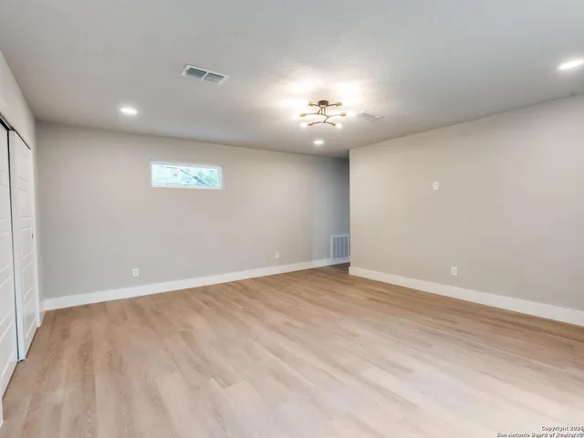 a view of a patio with table and chairs and potted plants