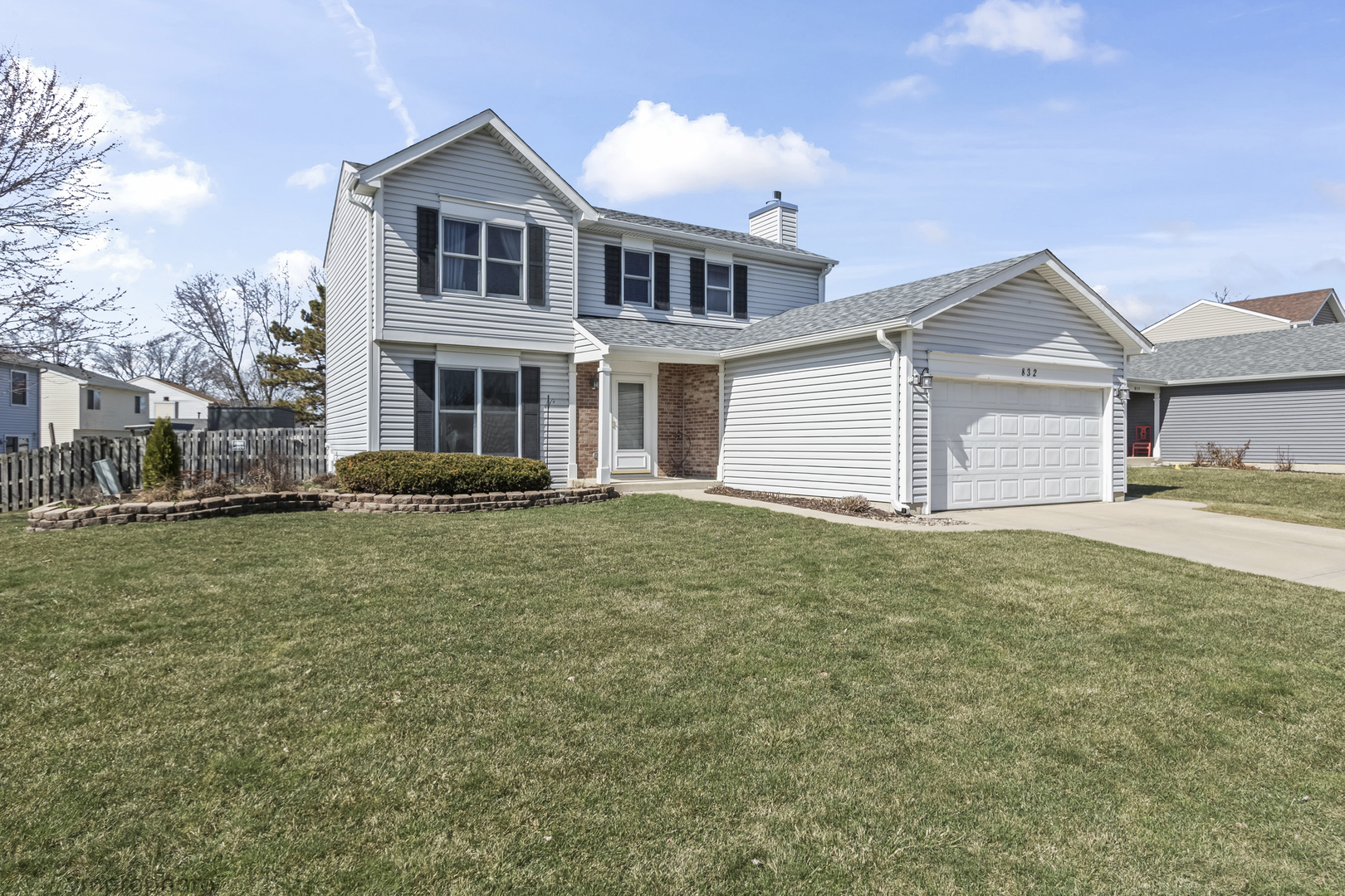 832 Kansas Street Carol Stream, IL 60188 - Photo 1 of 26 a front view of a house with a garden