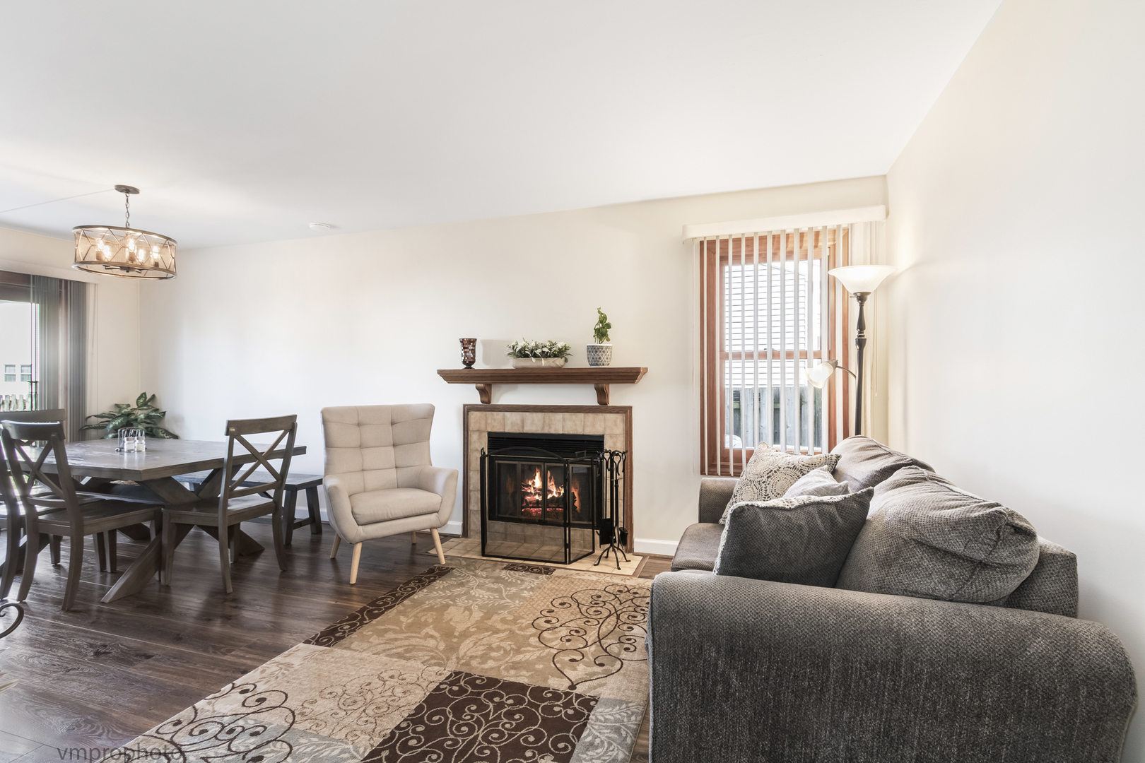 832 Kansas Street Carol Stream, IL 60188 - Photo 5 of 26 a living room with furniture and a fireplace