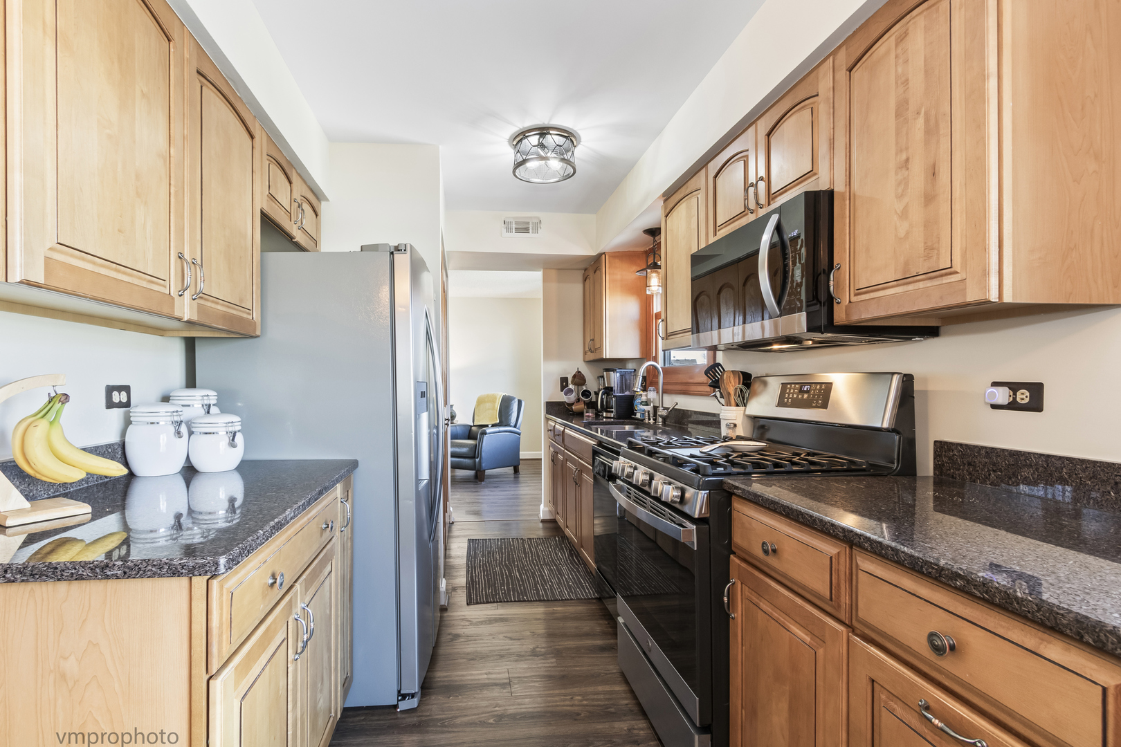 832 Kansas Street Carol Stream, IL 60188 - Photo 7 of 26 a kitchen with stainless steel appliances granite countertop a stove a sink dishwasher and a refrigerator