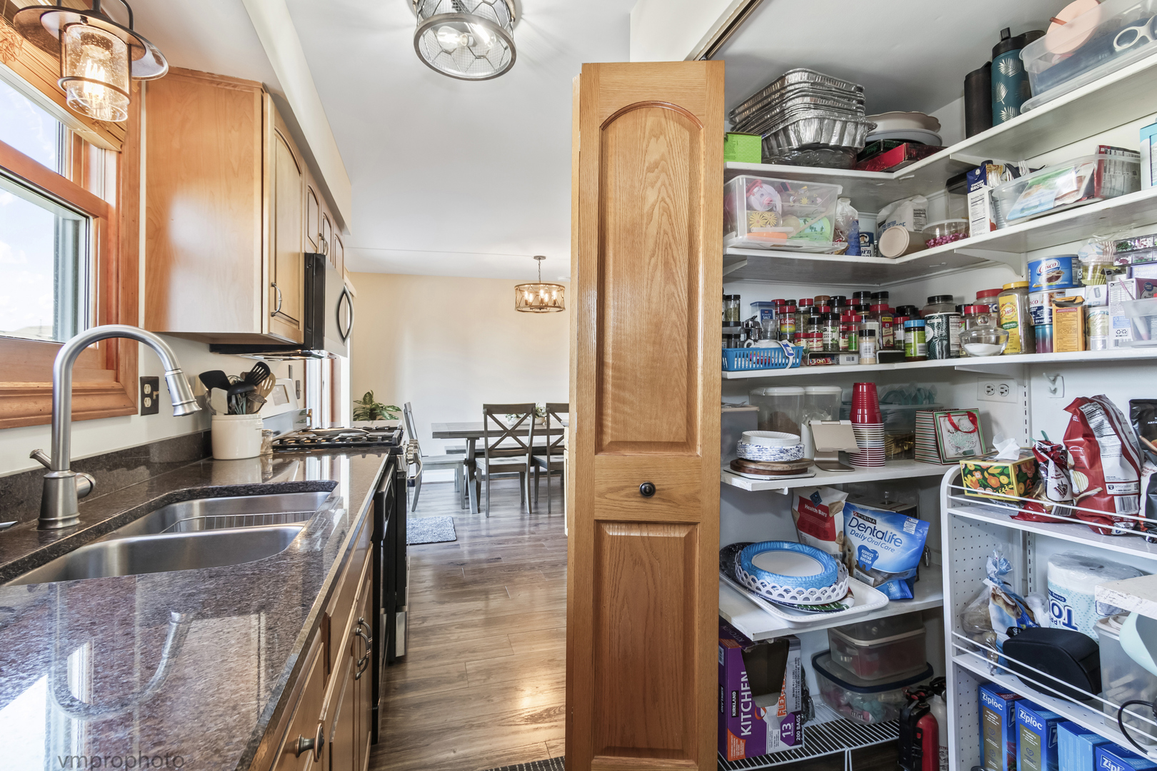 832 Kansas Street Carol Stream, IL 60188 - Photo 8 of 26 a kitchen with stainless steel appliances granite countertop a sink and cabinets