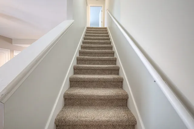 an entryway with a mirror