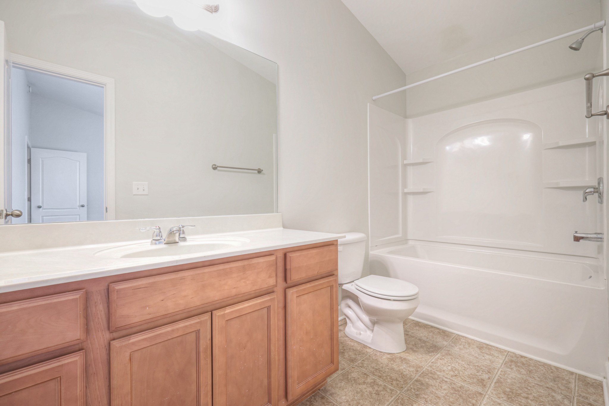 5441 Perlou Lane Murfreesboro, TN 37128 - Photo 24 of 29 a bathroom with a sink a toilet and a large mirror