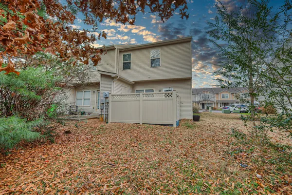 a view of a house with a yard and garage
