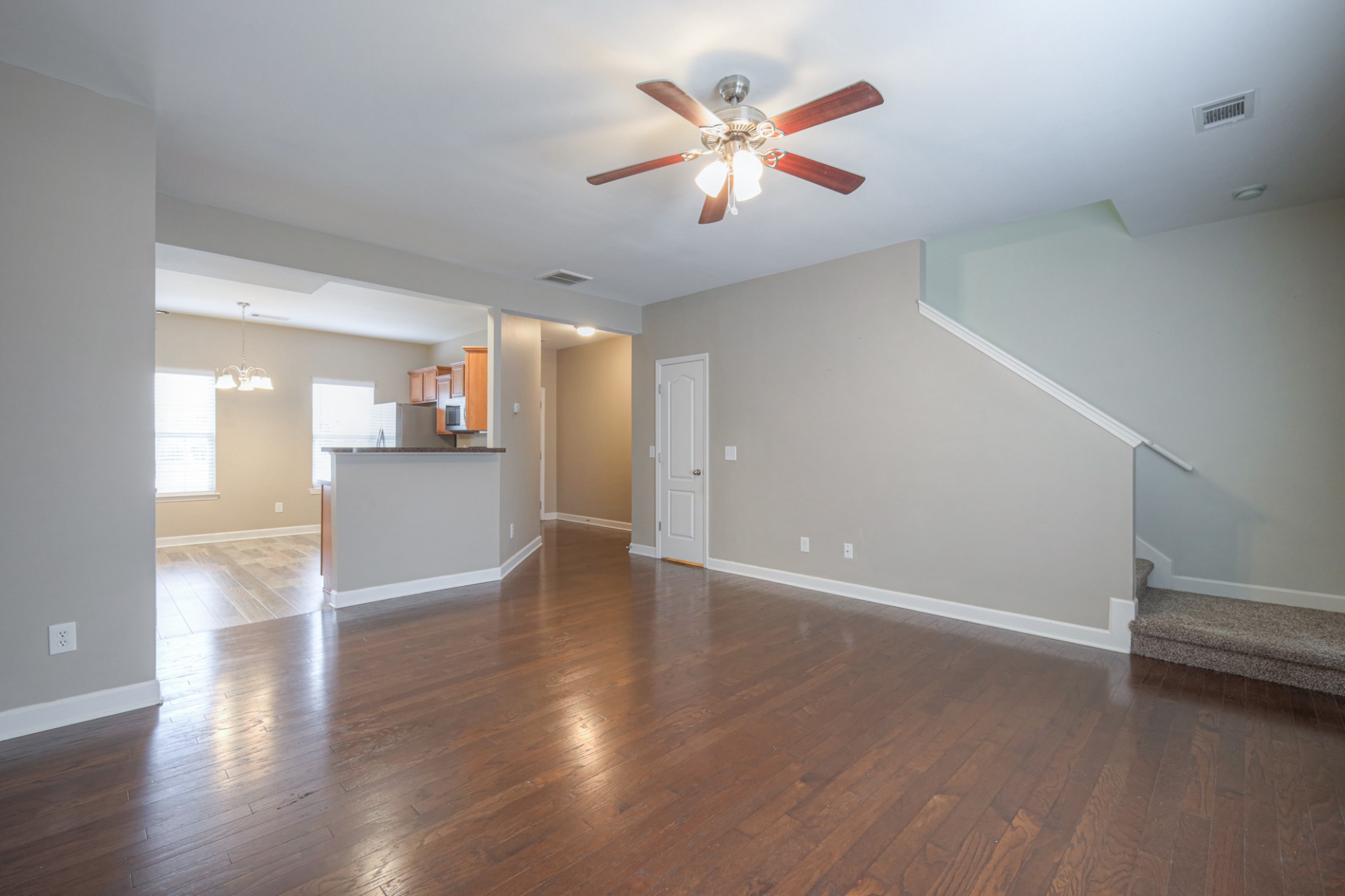 5441 Perlou Lane Murfreesboro, TN 37128 - Photo 7 of 29 an empty room with wooden floor and windows