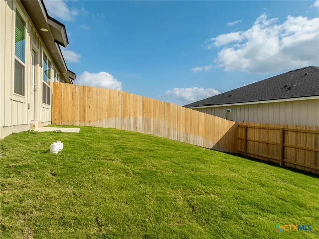 a view of swimming pool with a patio