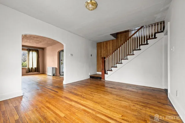 a view of an entryway with wooden floor