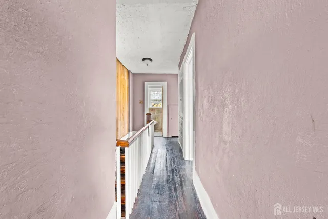 a bathroom with a granite countertop toilet sink and mirror