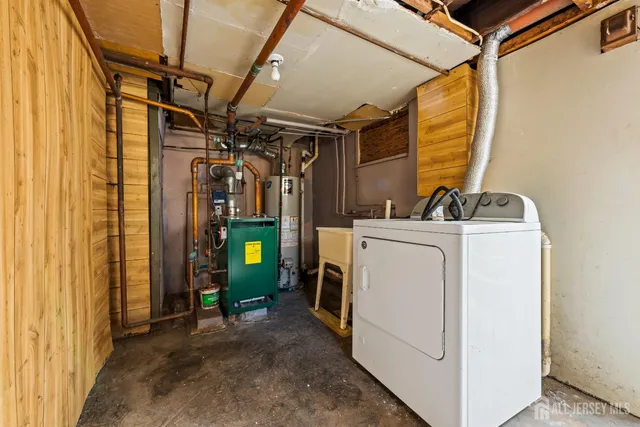 a view of a house with a big yard and large trees