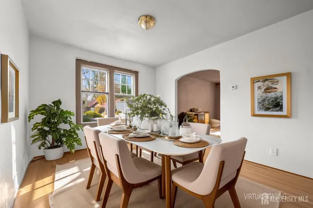 a dining room with furniture and window