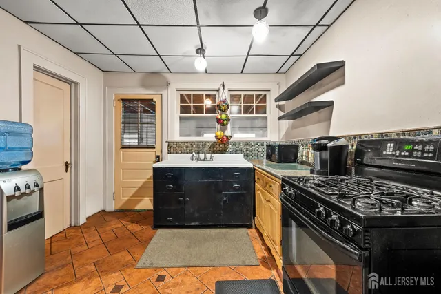 a kitchen with a stove and a sink