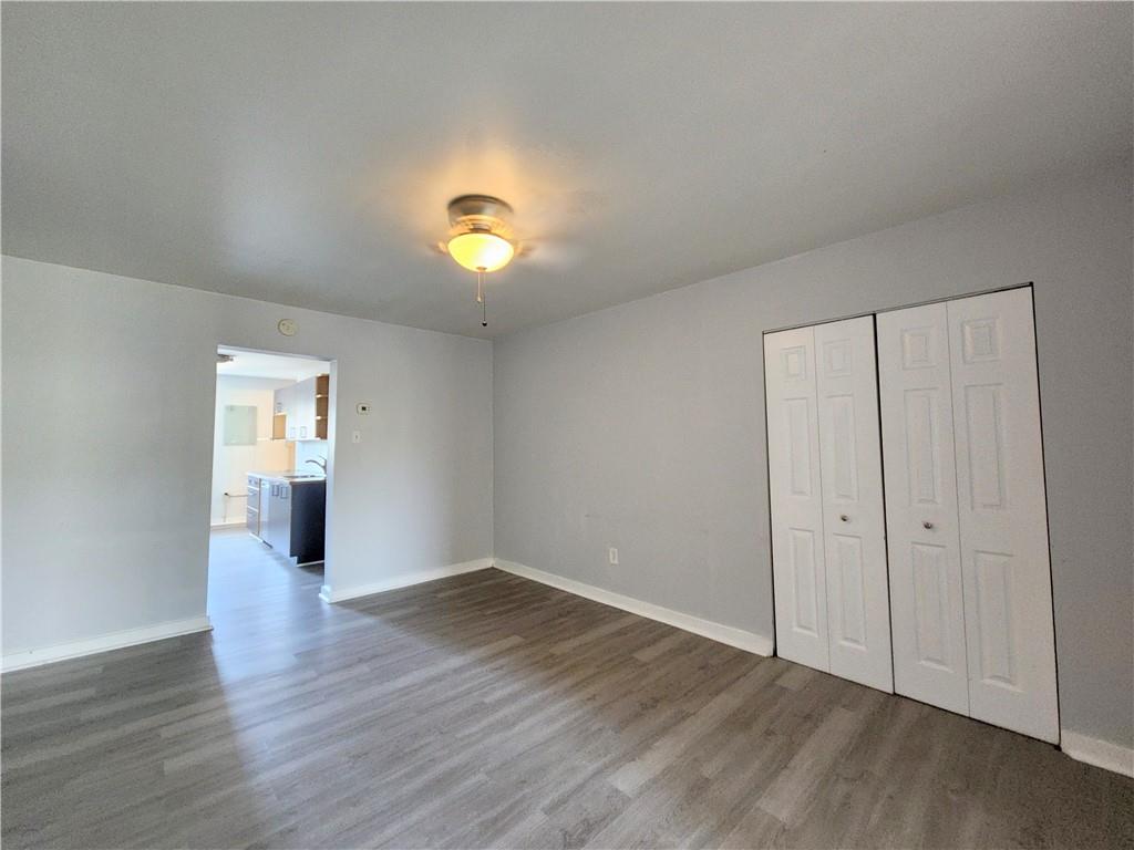 5237 Butler Street, Unit 2 Pittsburgh, PA 15201 - Photo 3 of 6 a view of a livingroom with wooden floor