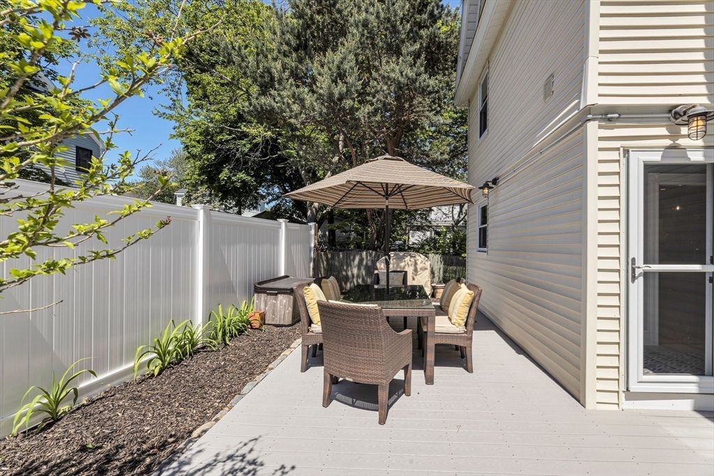112 Perham Street Boston, MA 02132 - Photo 30 of 36 a view of a patio with furniture and a backyard