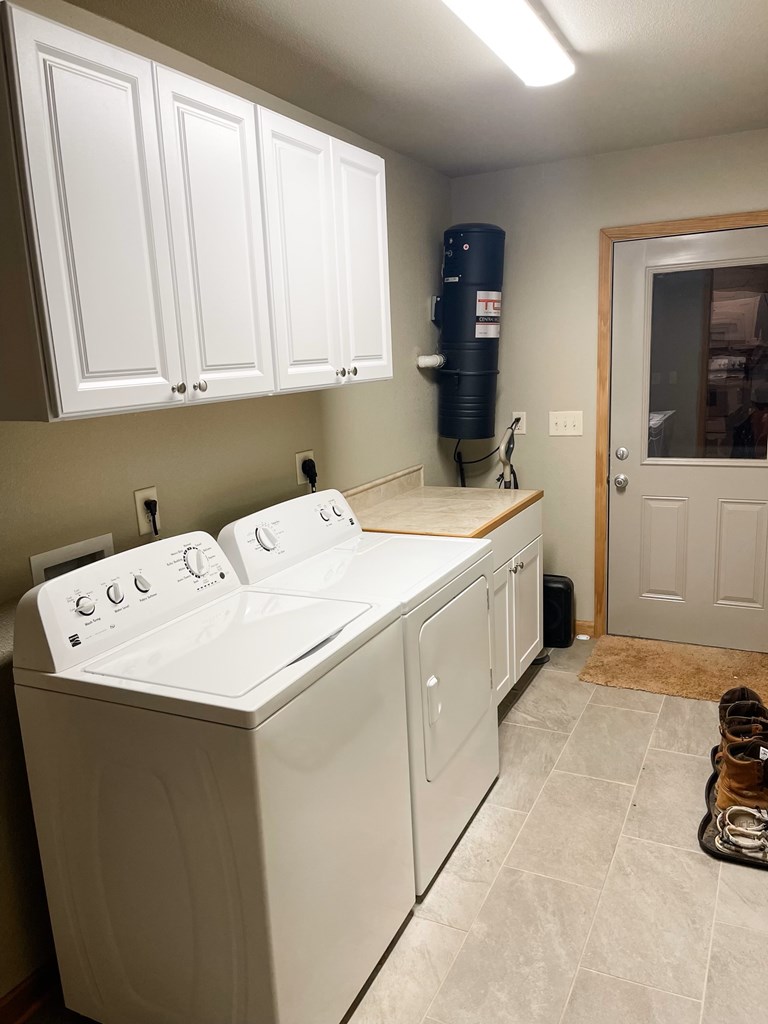 65 Rhubarb Lane Murphy, NC 28906 - Photo 4 of 12 a utility room with a sink a washer and dryer