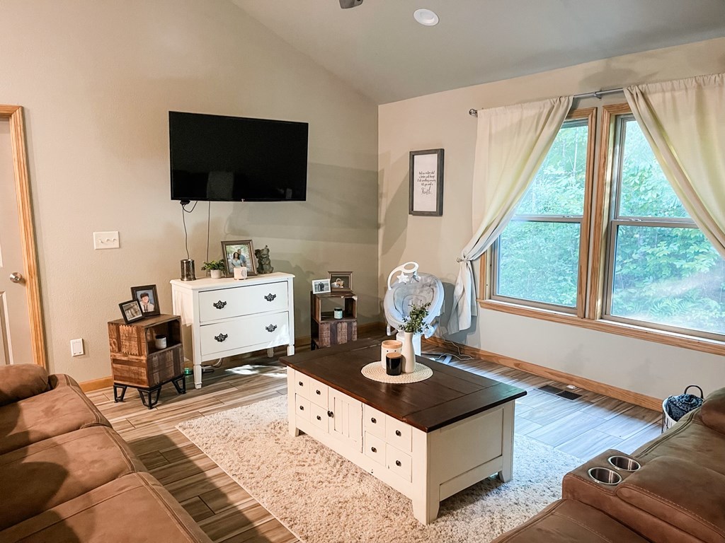 65 Rhubarb Lane Murphy, NC 28906 - Photo 6 of 12 a living room with furniture and flat screen tv