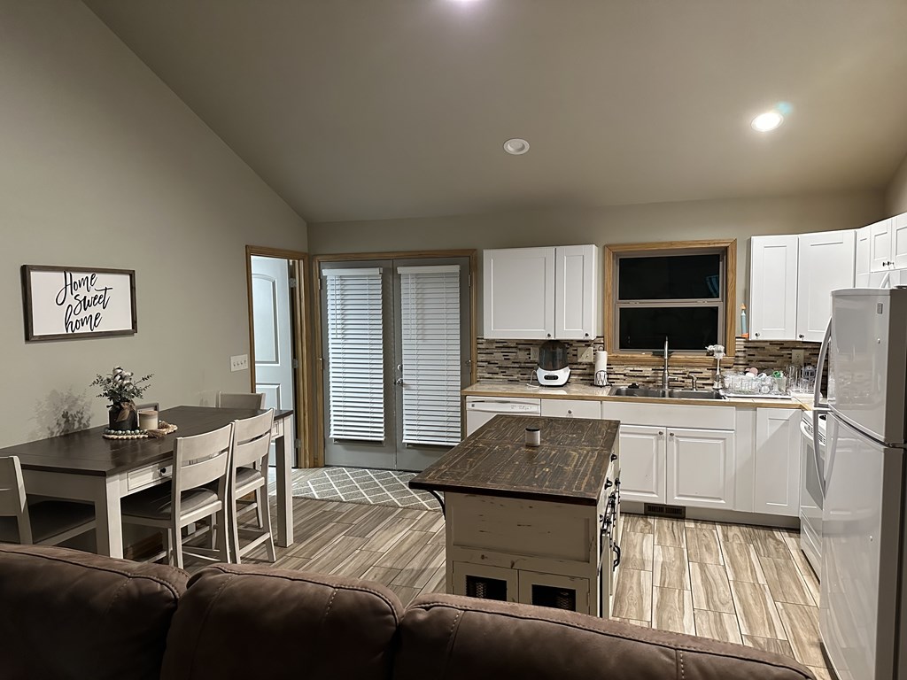 65 Rhubarb Lane Murphy, NC 28906 - Photo 8 of 12 a kitchen with stainless steel appliances granite countertop a stove and a refrigerator