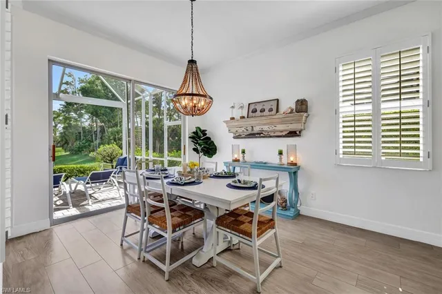 a view of a dining room with furniture window and outside view
