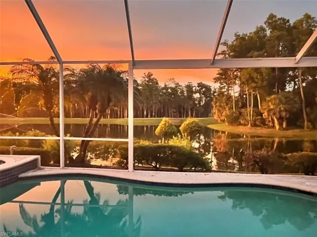 a view of a wooden deck with a yard