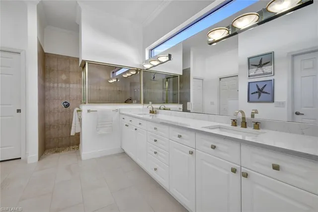 a spacious bathroom with a granite countertop sink mirror and double