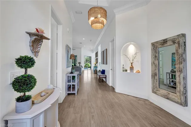 a view of a livingroom with furniture and a potted plant