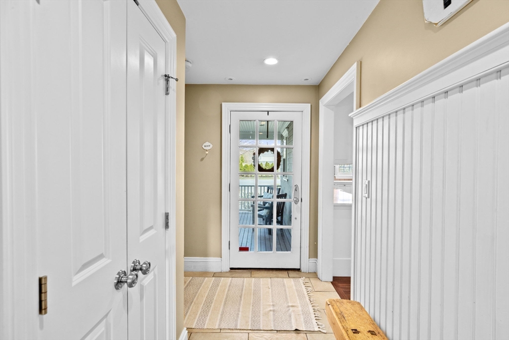 50 Pleasant Street Hingham, MA 02043 - Photo 13 of 41 a view of a hallway with wooden floor and a bathroom