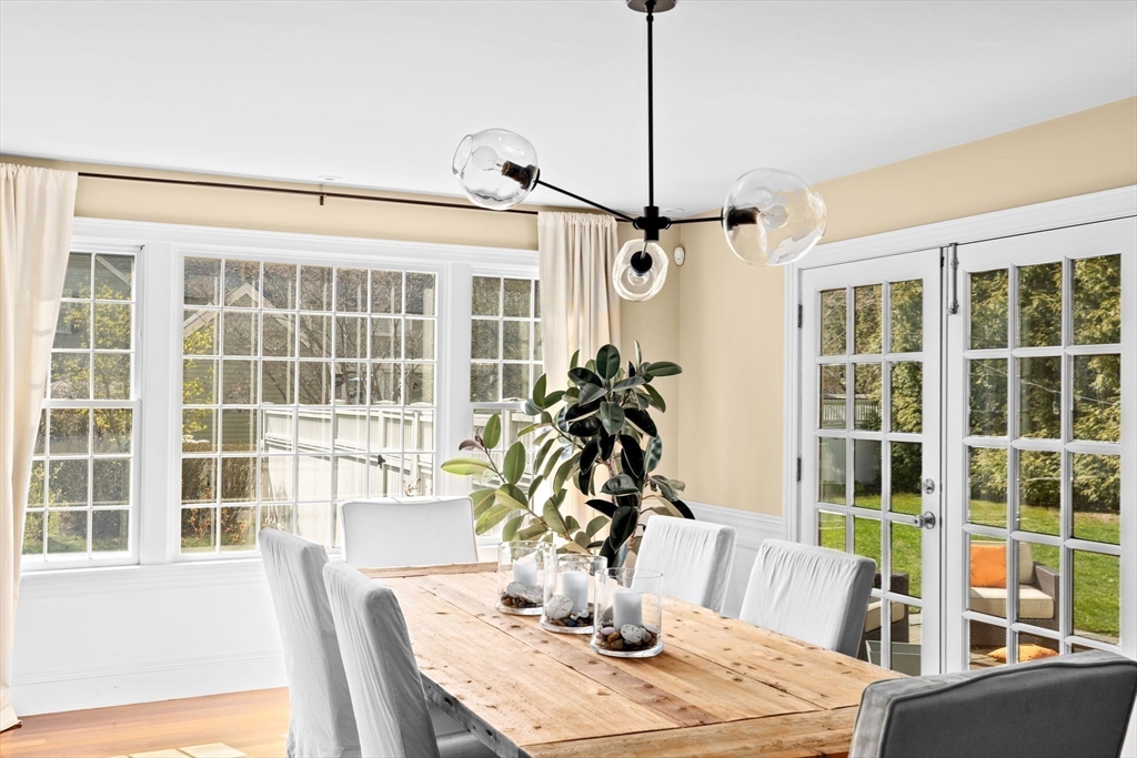 50 Pleasant Street Hingham, MA 02043 - Photo 15 of 41 a view of a dining room with furniture large windows and wooden floor