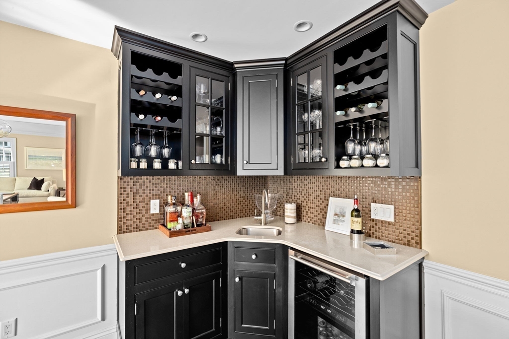 50 Pleasant Street Hingham, MA 02043 - Photo 18 of 41 a kitchen with stainless steel appliances a sink and cabinets