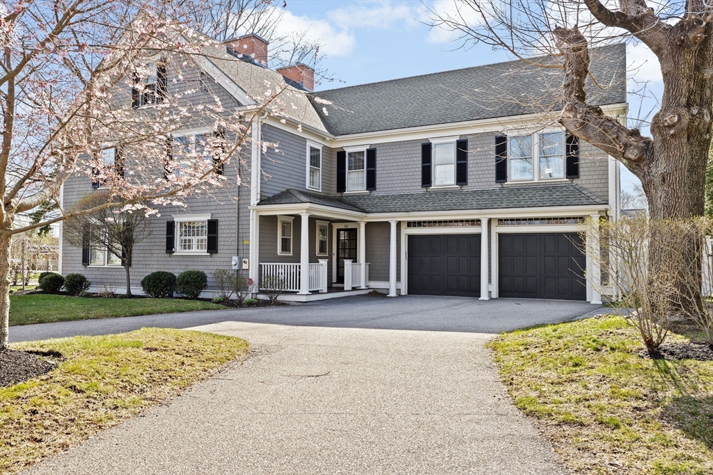 50 Pleasant Street Hingham, MA 02043 - Photo 2 of 41 a front view of a house with a yard and garage