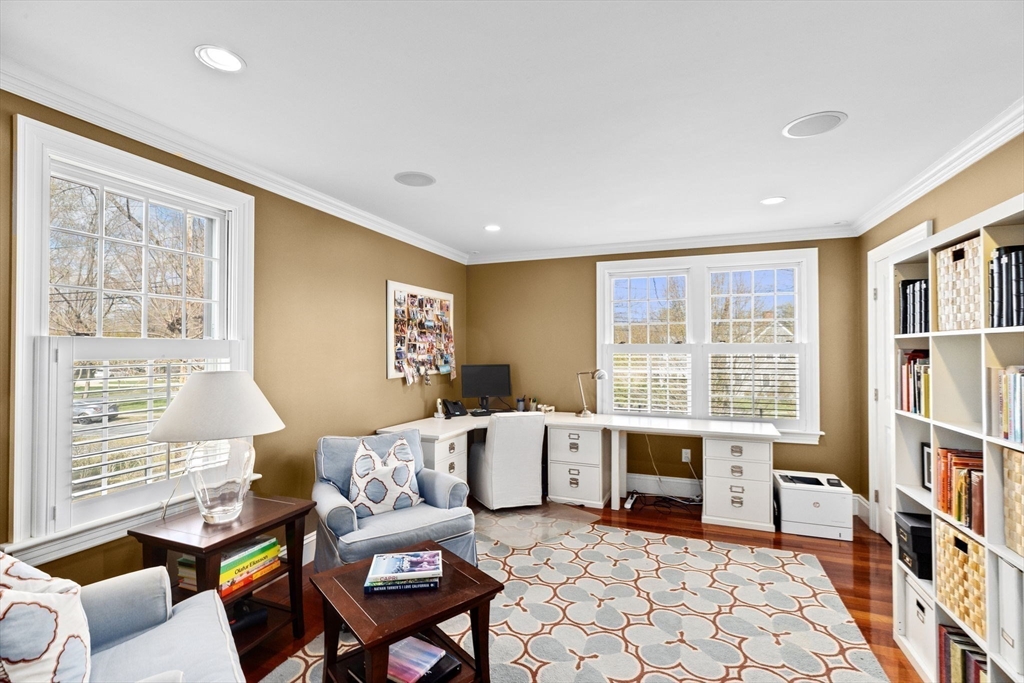 50 Pleasant Street Hingham, MA 02043 - Photo 22 of 41 a living room with furniture a bookshelf and a window