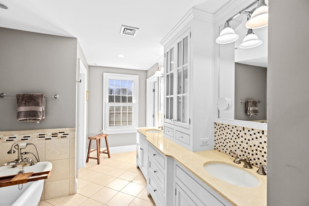 50 Pleasant Street Hingham, MA 02043 - Photo 26 of 41 a spacious bathroom with a tub sink and mirror