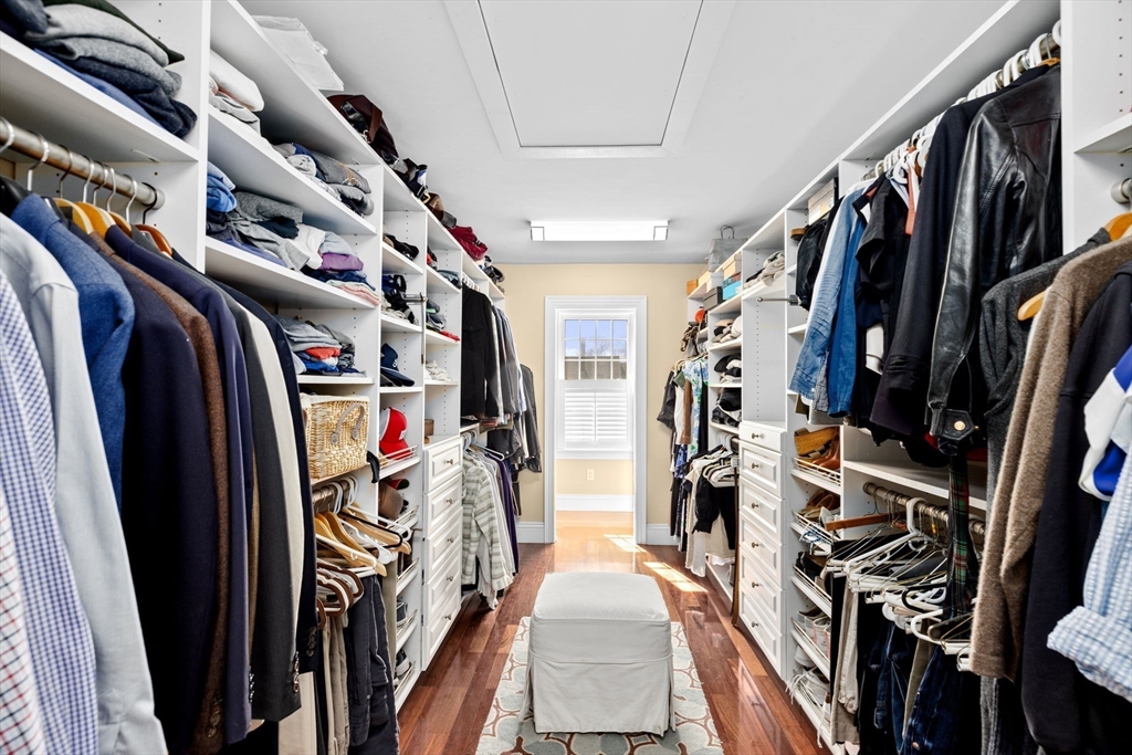 50 Pleasant Street Hingham, MA 02043 - Photo 29 of 41 a view of walk in closet with clothes and shoes