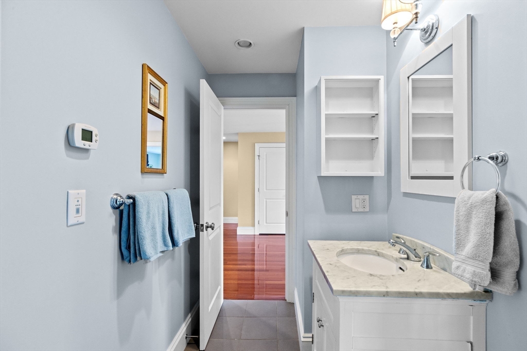 50 Pleasant Street Hingham, MA 02043 - Photo 31 of 41 a bathroom with a sink vanity and a mirror