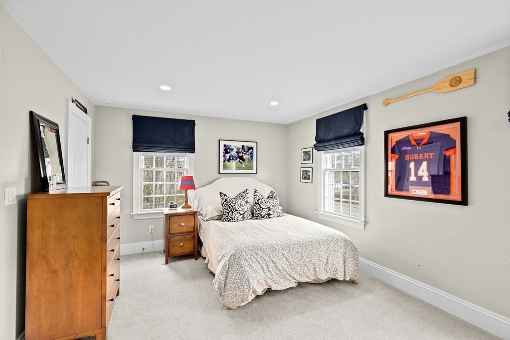 50 Pleasant Street Hingham, MA 02043 - Photo 33 of 41 a bedroom with a bed and a flat screen tv