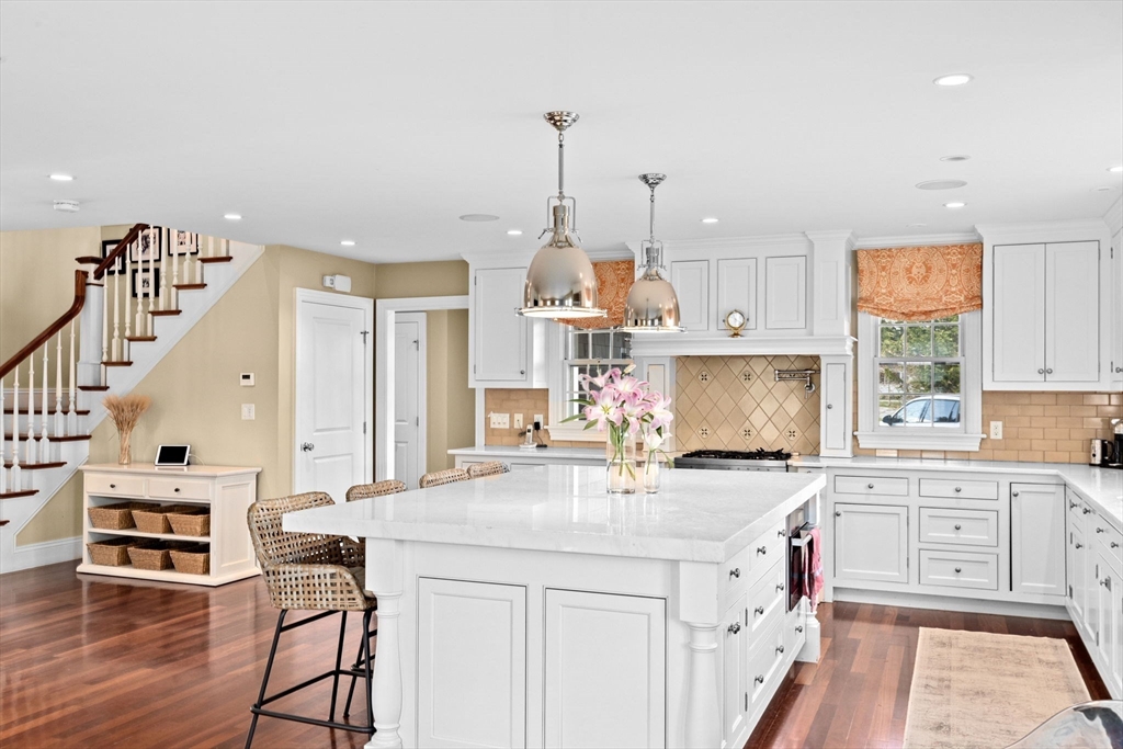 50 Pleasant Street Hingham, MA 02043 - Photo 4 of 41 a kitchen with a sink cabinets and window
