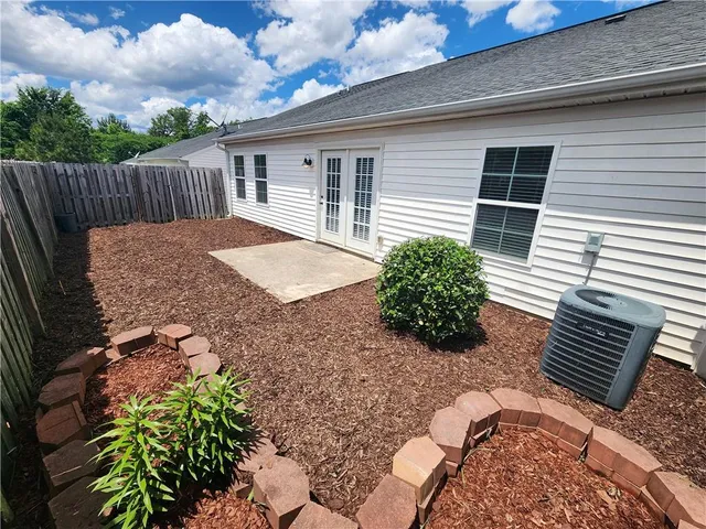 a view of a backyard with a garden