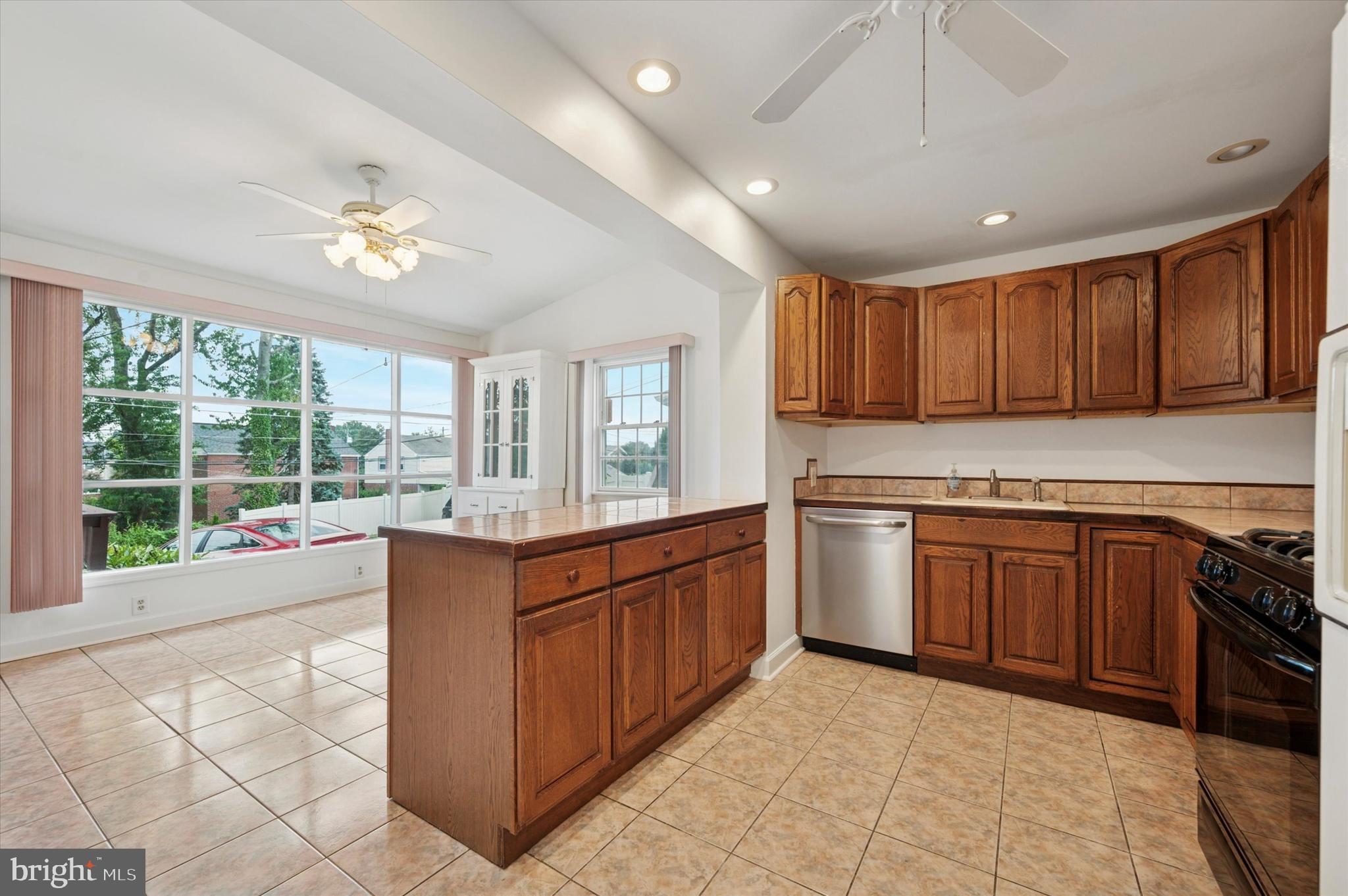 211 East Manoa Road Havertown, PA 19083 - Photo 8 of 29 a kitchen with stainless steel appliances granite countertop a stove and a sink