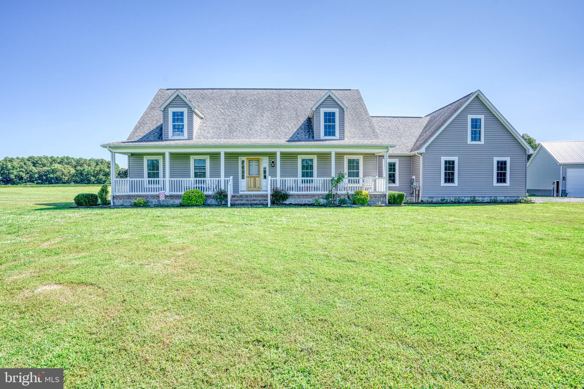 29862 Paddock Lane Easton, MD 21601 - Photo 2 of 83 a view of a house next to a big yard and large trees
