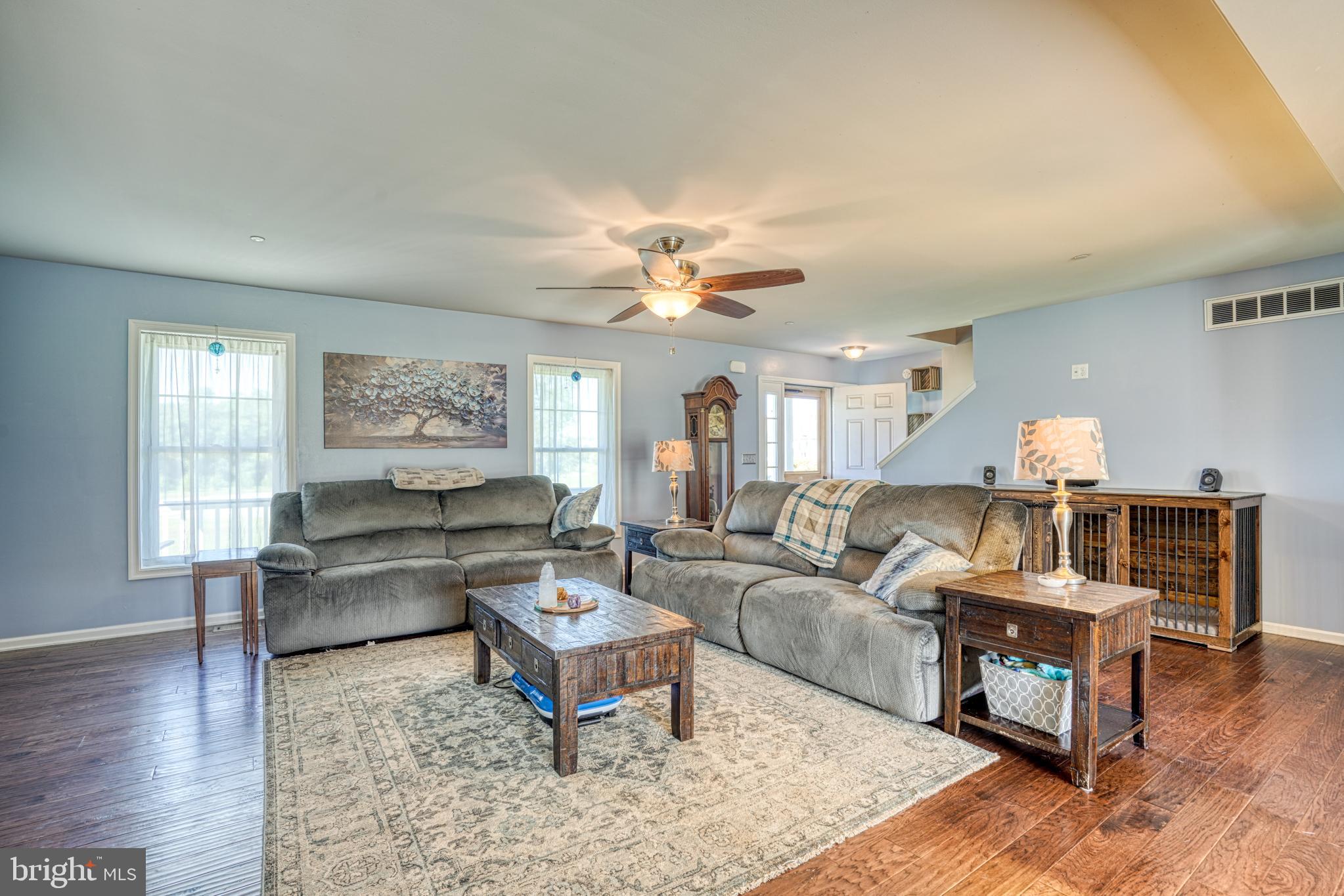29862 Paddock Lane Easton, MD 21601 - Photo 22 of 83 a living room with furniture and a wooden floor